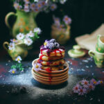 Cottage cheese pancakes, syrniki, curd fritters with frozen berr