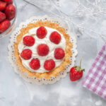 top-view-little-yummy-cake-with-cream-fresh-red-strawberries-light-desk-cake-fruit-biscuit-cream
